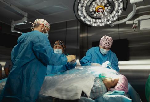 Surgeons operating on a patient